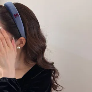 Vintage blue velvet wide headband with delicate maroon bow embroidery for women.