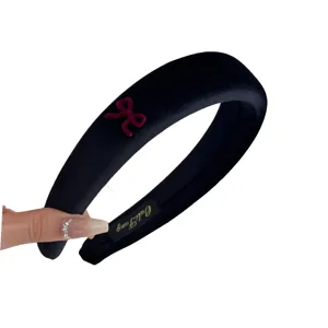 Elegant black velvet padded headband with small red bow, autumn fashion hair accessory