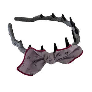 Vintage Mori style headband featuring a purple patterned bow and black comb teeth detail