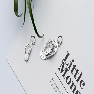 Macro detail of S925 sterling silver flip-flop charms for DIY jewelry making accessories