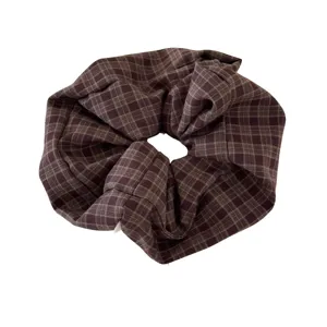 Vintage dark plaid oversized scrunchie for hair styling in a minimalist white background