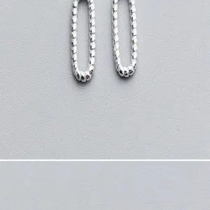 Close-up detail of retro S925 sterling silver threaded oval closed loops for DIY jewelry making.