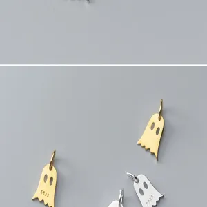 Detailed macro view of S925 sterling silver ghost pendants in gold and silver finishes.
