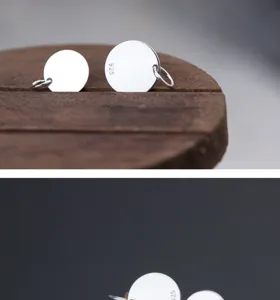 Macro view of polished S925 sterling silver round disc charms for DIY jewelry making