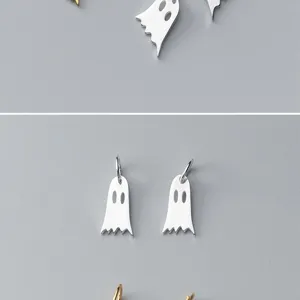 Detailed macro view of S925 sterling silver ghost pendants for DIY jewelry making and crafts