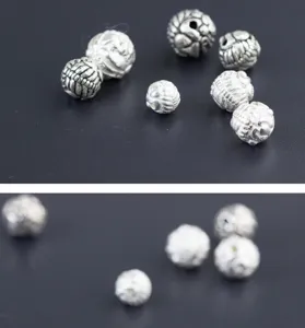Close-up van S925 Thais zilveren Pixiu kralen met antiek snijwerk voor DIY sieraden.