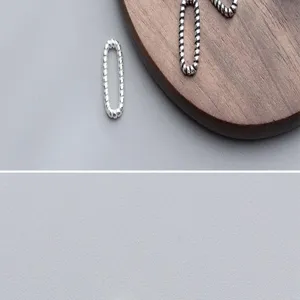 Close-up of S925 sterling silver textured oval closed rings for handmade jewelry making