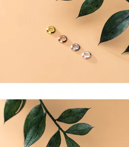 Detail view of thin S925 silver round bead spacers in various metallic finishes for DIY jewelry.