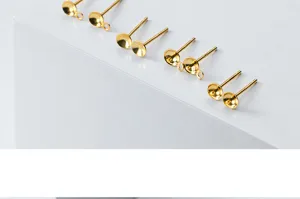 Macro detail shot of gold-plated S925 sterling silver earring studs with pearl trays