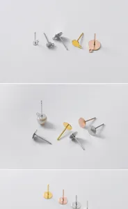 Gedetailleerde close-up van DIY sterling zilveren oorknopjes met lus en platte basisplaat.