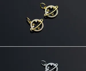 Detailed close-up of micro-pave zircon planet and star pendants in gold and silver