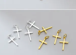 Macro detail showing polished silver and gold-plated S925 silver cross pendants for DIY jewelry