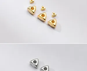 Detailed macro view of S925 sterling silver geometric triangular gold and silver spacer beads