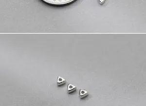 Close-up detail of S925 sterling silver triangular spacer beads for jewelry making