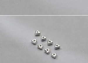 Macro view of S925 sterling silver geometric triangle spacer beads for handmade jewelry