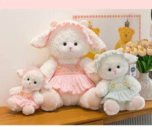 Collection of three cute plush sheep dolls wearing pink and green dresses and hats for gifts