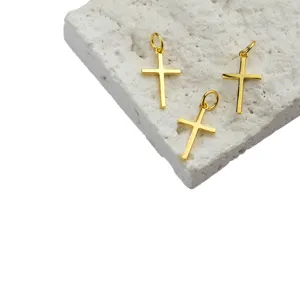 Minimalist S925 silver gold-plated smooth cross pendants on a white stone background