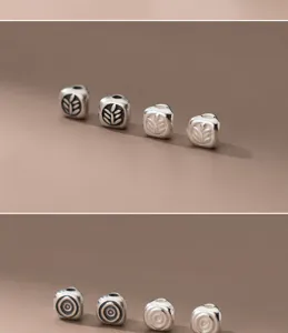 Macro detail view of S925 sterling silver spacer beads with leaf and circle patterns