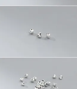 Close-up of S925 sterling silver triangular spacer beads for DIY jewelry making