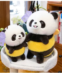 Close-up of cute panda bee plush toys with soft fuzzy texture and striped wings