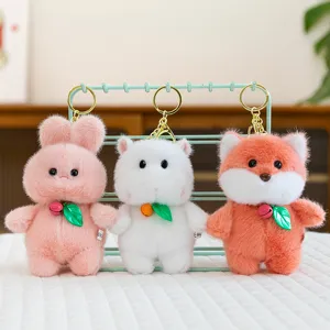 Cute cartoon plush animal keychain set featuring fluffy plush toys with bells and leaf pendants.