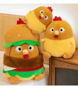 Cute hamburger-shaped chicken plush toy stacked with chick dolls on a wooden table