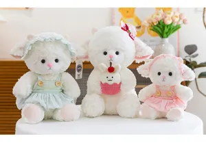 Group of three adorable white sheep plush dolls in pastel dresses as gift for kids