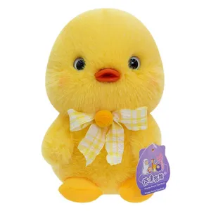 Adorable yellow duckling plush toy with a checkered bow tie and soft fluffy fur