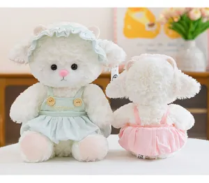 Soft and cuddly white lamb plush dolls wearing adorable mint green and pink ruffled outfits