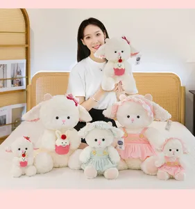 Collection of cute white sheep plush toys in various sizes and outfits shown with model.