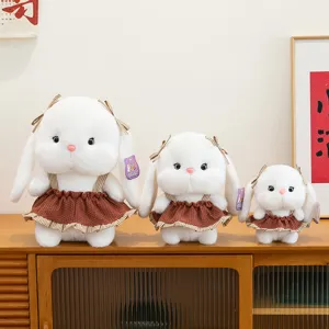 Lot de trois adorables peluches lapin blanc de différentes tailles avec robe marron