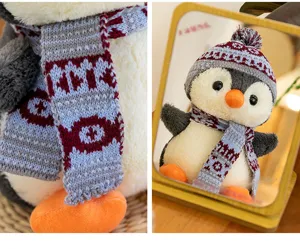Detailed texture of the knitted scarf on a cute plush penguin doll wearing a hat