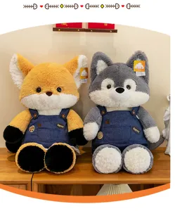 Close-up of cute plush fox and wolf animals wearing blue denim overalls on a shelf.