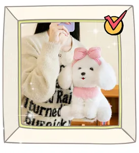 Close-up of a white poodle plush toy with a pink bow and lace bib held by a girl.