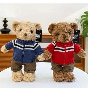 Cute plush teddy bear toy with knitted sweater, soft stuffed animal gift for kids.