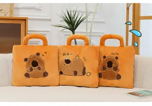 Three orange capybara plush pillows featuring cute embroidered sleeping designs