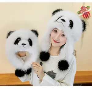 Macro view of thick plush panda winter earflap hat with black pom-poms on model