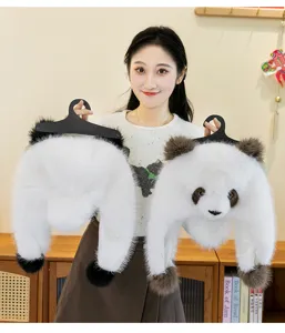 Asian model holding cute panda plush hats with soft faux mink fur and ear flaps