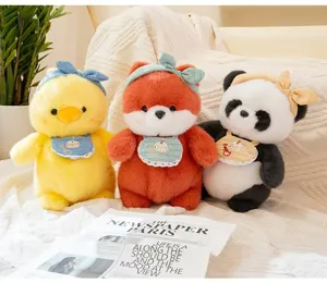 Detailed view of cute plush duck, fox, and panda dolls wearing headbands and bibs.
