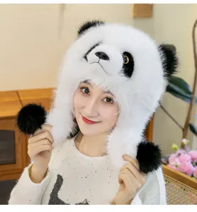 Detail view of a model wearing a thick plush panda-shaped winter hat with earflaps