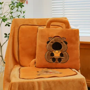 Cute capybara plush pillow and blanket set crafted from warm orange soft fleece material.