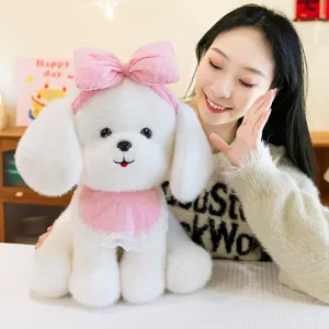 Adorable white plush dog toy with pink bow and lace bib for a perfect child's birthday gift