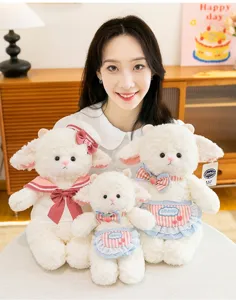 Adorable white lamb plush toys in three sizes presented by a model for gifting.
