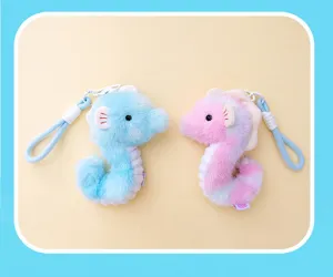 Pair of soft blue and pink plush seahorse keychains for schoolbags and backpacks.