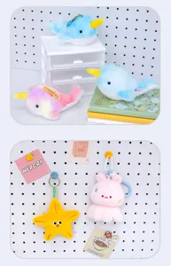 Detailed view of colorful plush narwhal and starfish keychains in a cute room setup.