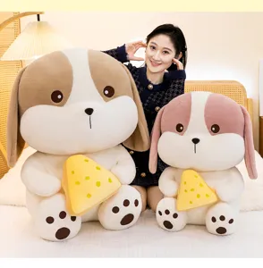 Cute cheese dog plush toy in two sizes held by an Asian model in a cozy bedroom.