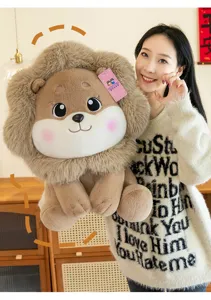 Detail view of a cute cartoon lion plush toy held by a model in a cozy home setting.