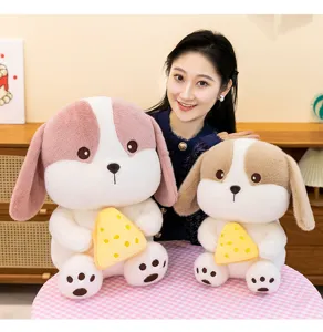 Cute cheese dog plush toys in two different sizes held by a smiling female model in a cozy room.
