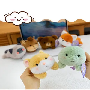 Close-up of various cute cartoon plush animal head magnets for car and fridge decoration