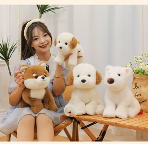 Group of cute plush dog stuffed animals in various styles held by a smiling girl